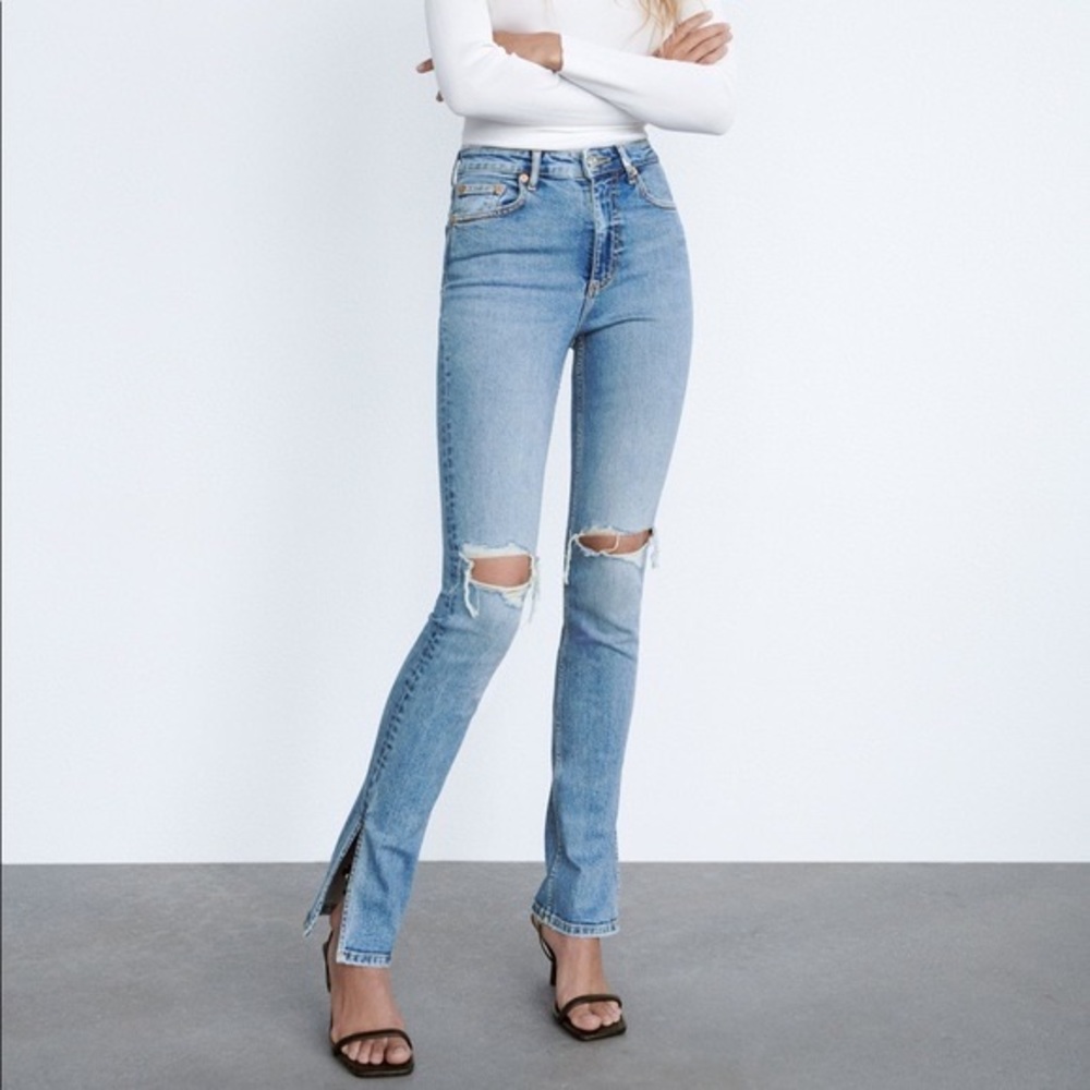 Size US 4 Zara hi-rise slim flare jeans with split hem in medium blue denim.